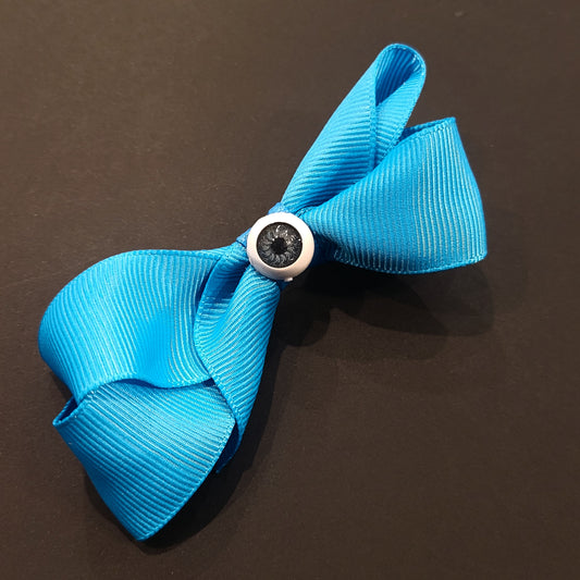 Boucle à cheveux bleue oeil bleu