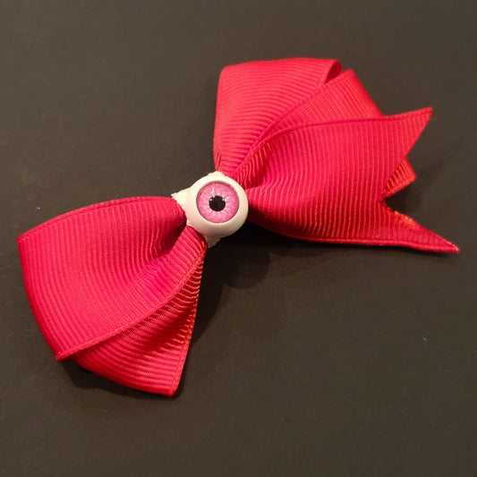 Boucle à cheveux rouge oeil rose